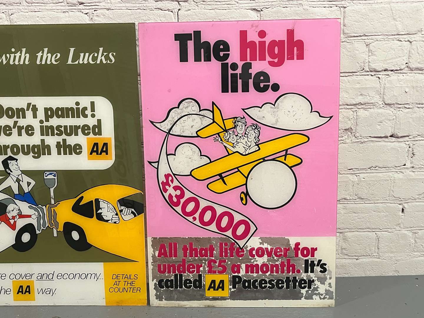 <p>Two Perspex AA Signs</p>