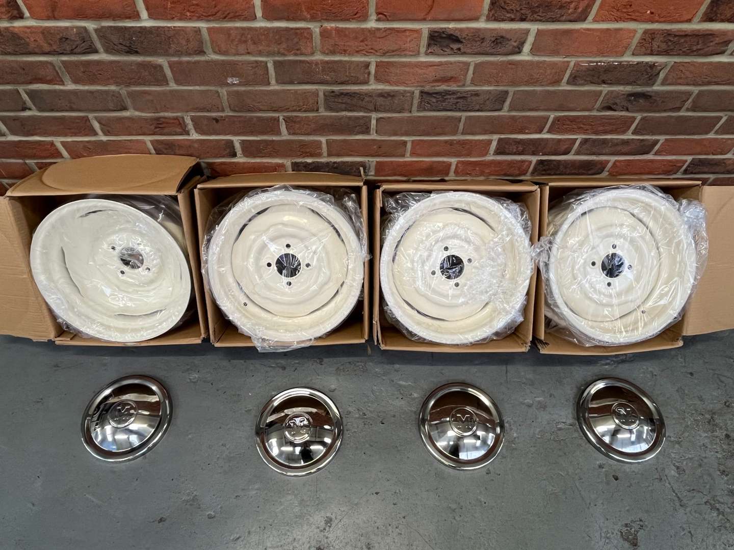 <p>Set of Four Boxed Morris Minor Wheels and Chrome Trims&nbsp;</p>
