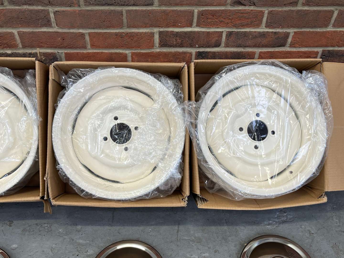<p>Set of Four Boxed Morris Minor Wheels and Chrome Trims&nbsp;</p>