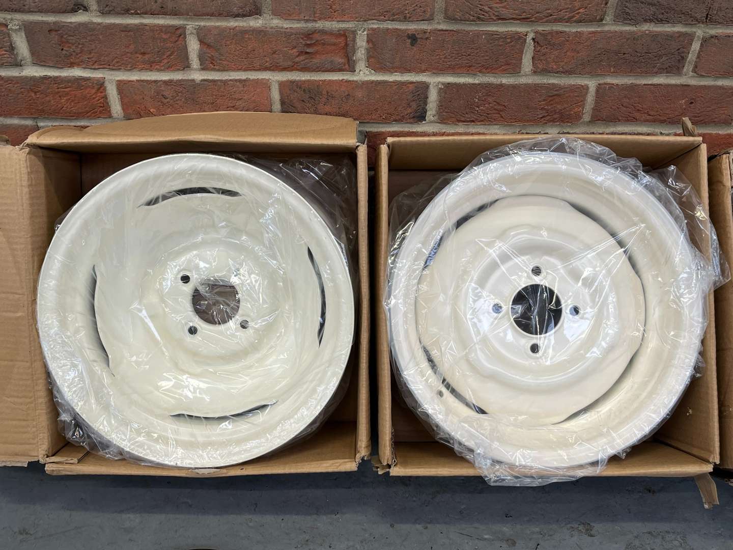 <p>Set of Four Boxed Morris Minor Wheels and Chrome Trims&nbsp;</p>