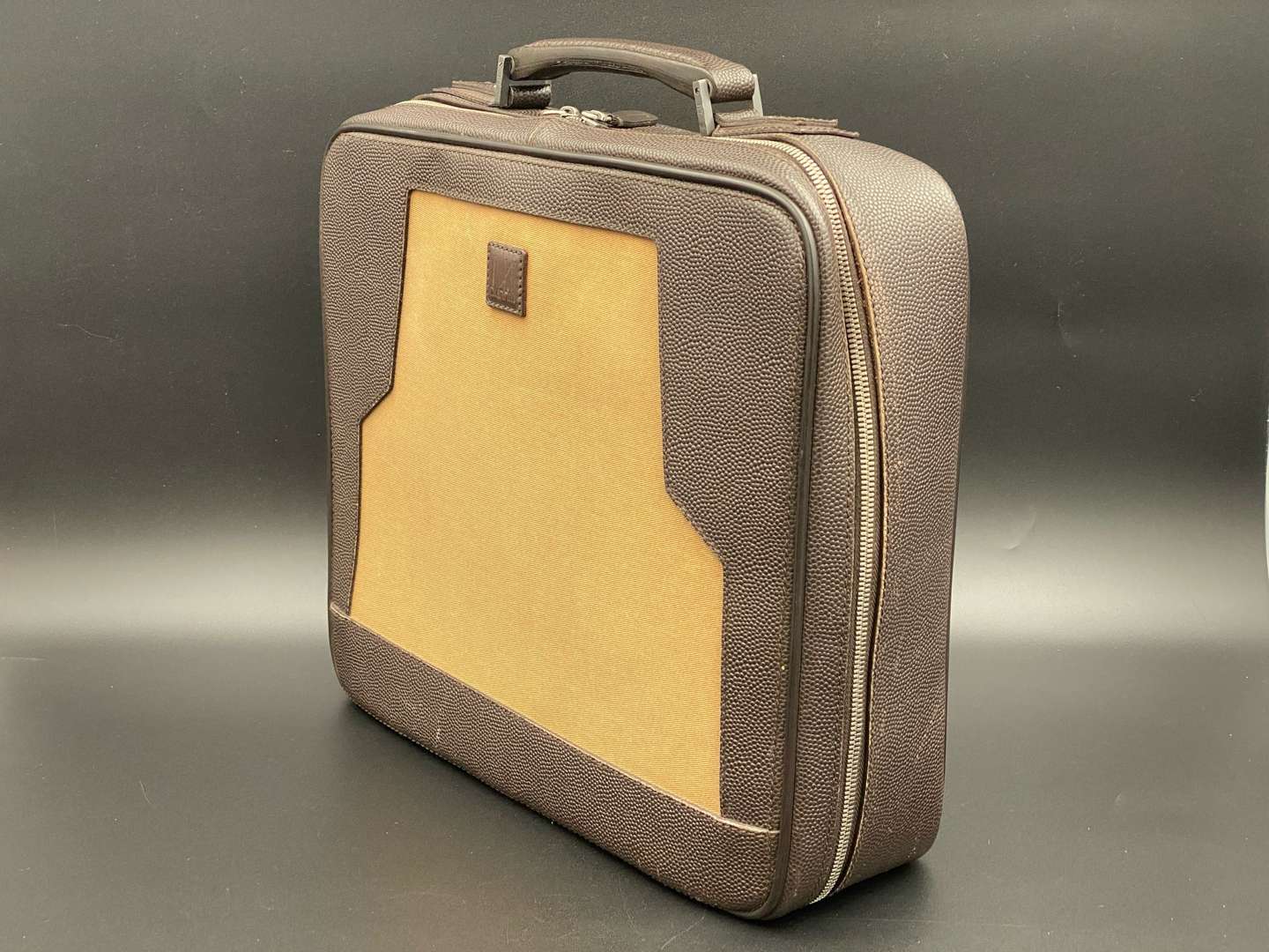 <p>DUNHILL, stitched brown leather and canvas business bag,&nbsp;</p>