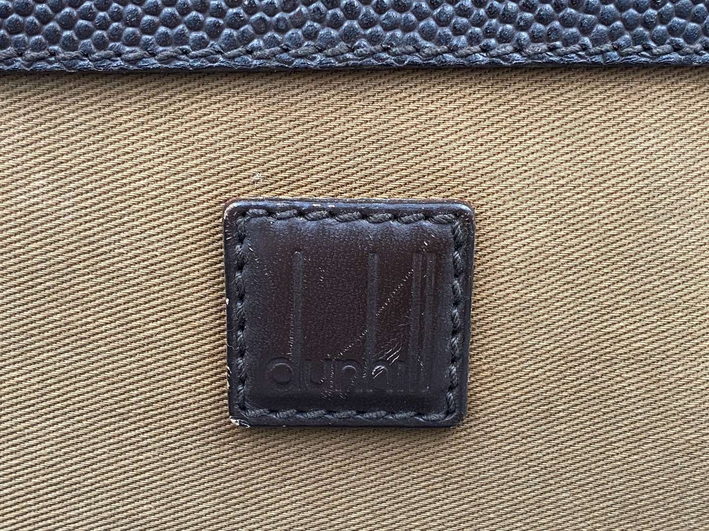 <p>DUNHILL, stitched brown leather and canvas business bag,&nbsp;</p>