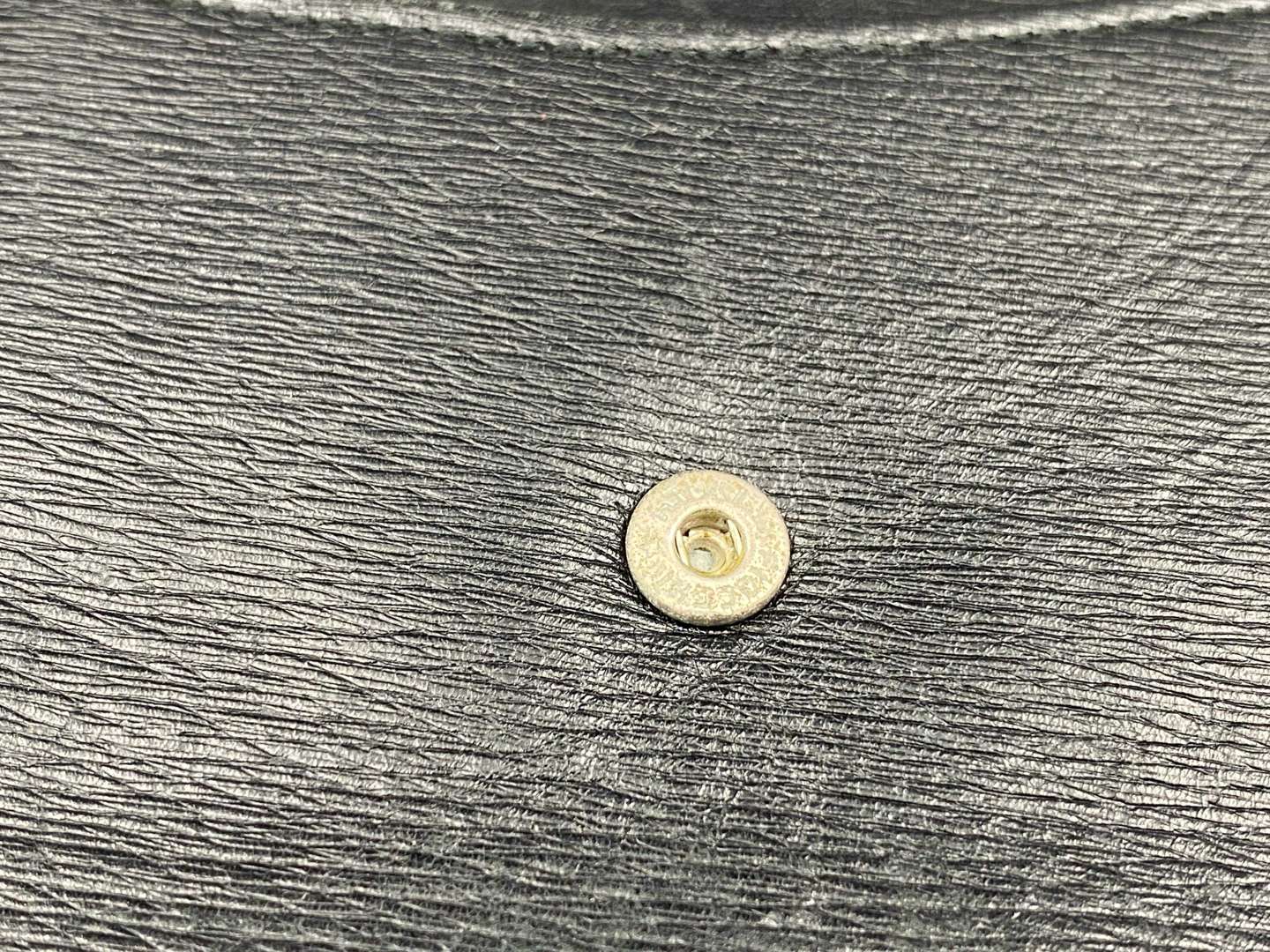 <p>GUCCI, &nbsp;a black, grained, leather wallet with signed and polished clasp</p>