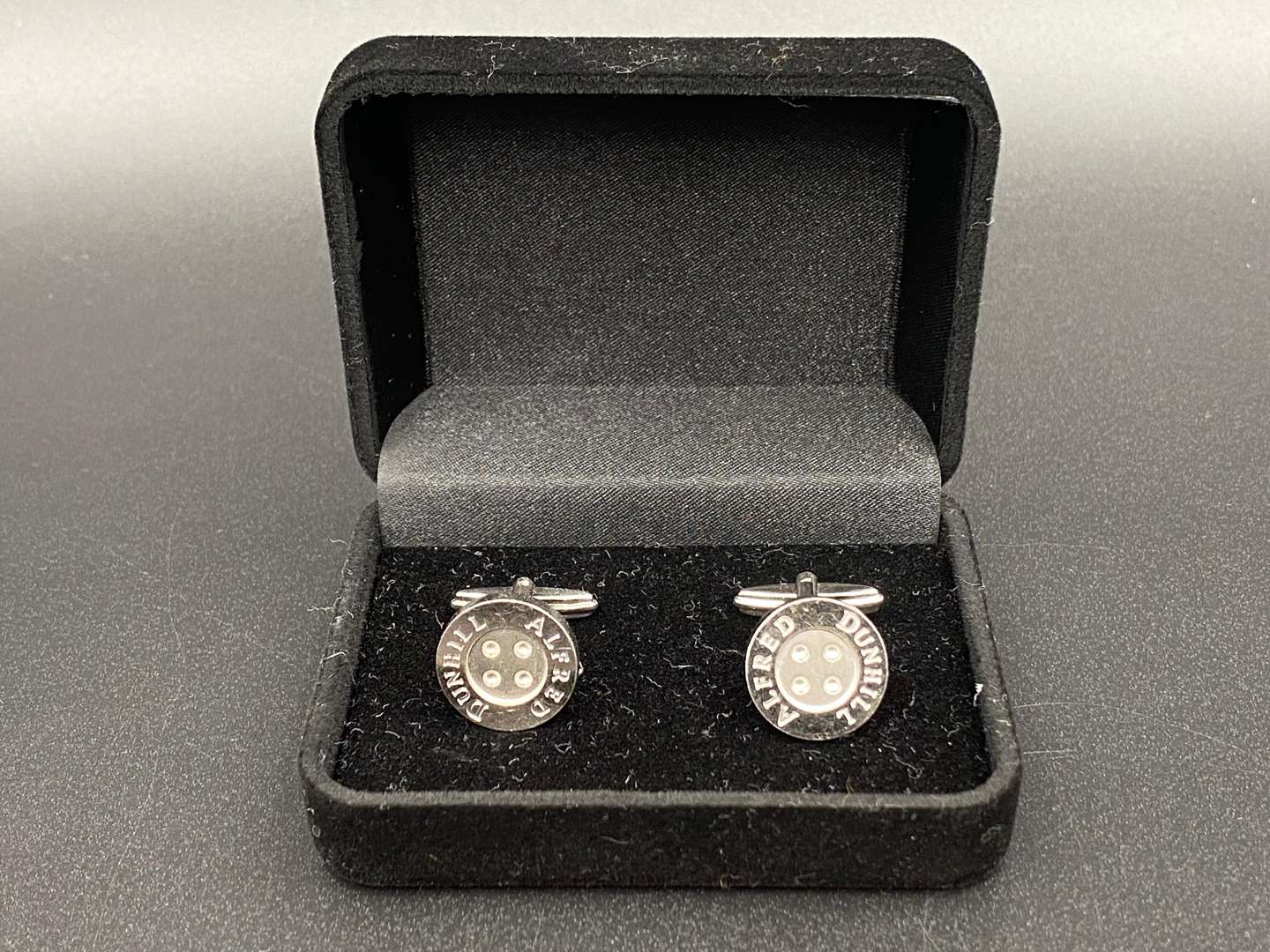 <p>DUNHILL, A pair of signed Button cufflinks,</p>