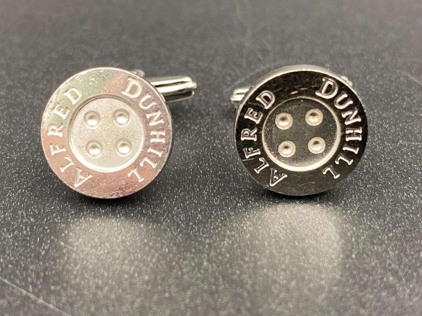 <p>DUNHILL, A pair of signed Button cufflinks,</p>