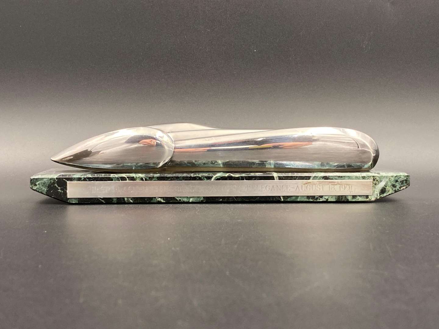 <p>"FIRST PLACE, PEBBLE BEACH CONCOURS d ELEGANCE, AUGUST 18. 1991", silver and marble trophy,&nbsp;</p>