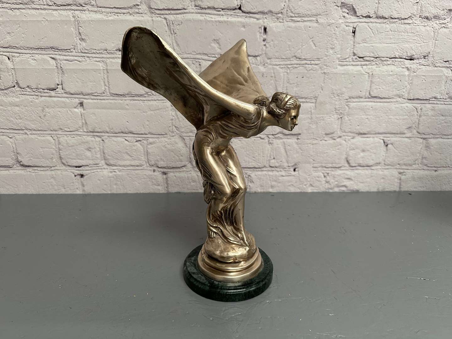 <p>&nbsp;“Spirit of Ecstasy” a late 20th century silvered cast metal desk mascot,</p>