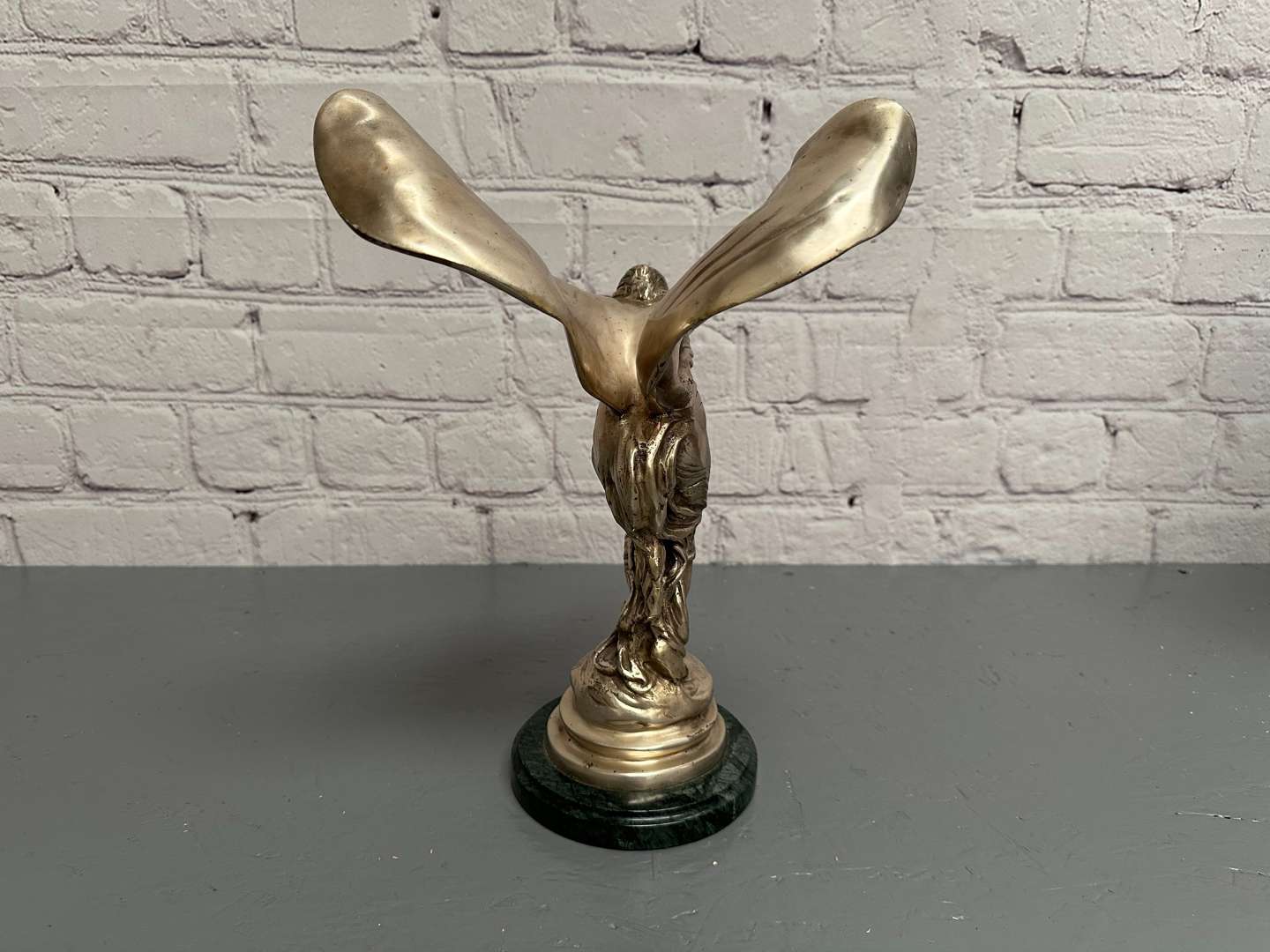 <p>&nbsp;“Spirit of Ecstasy” a late 20th century silvered cast metal desk mascot,</p>
