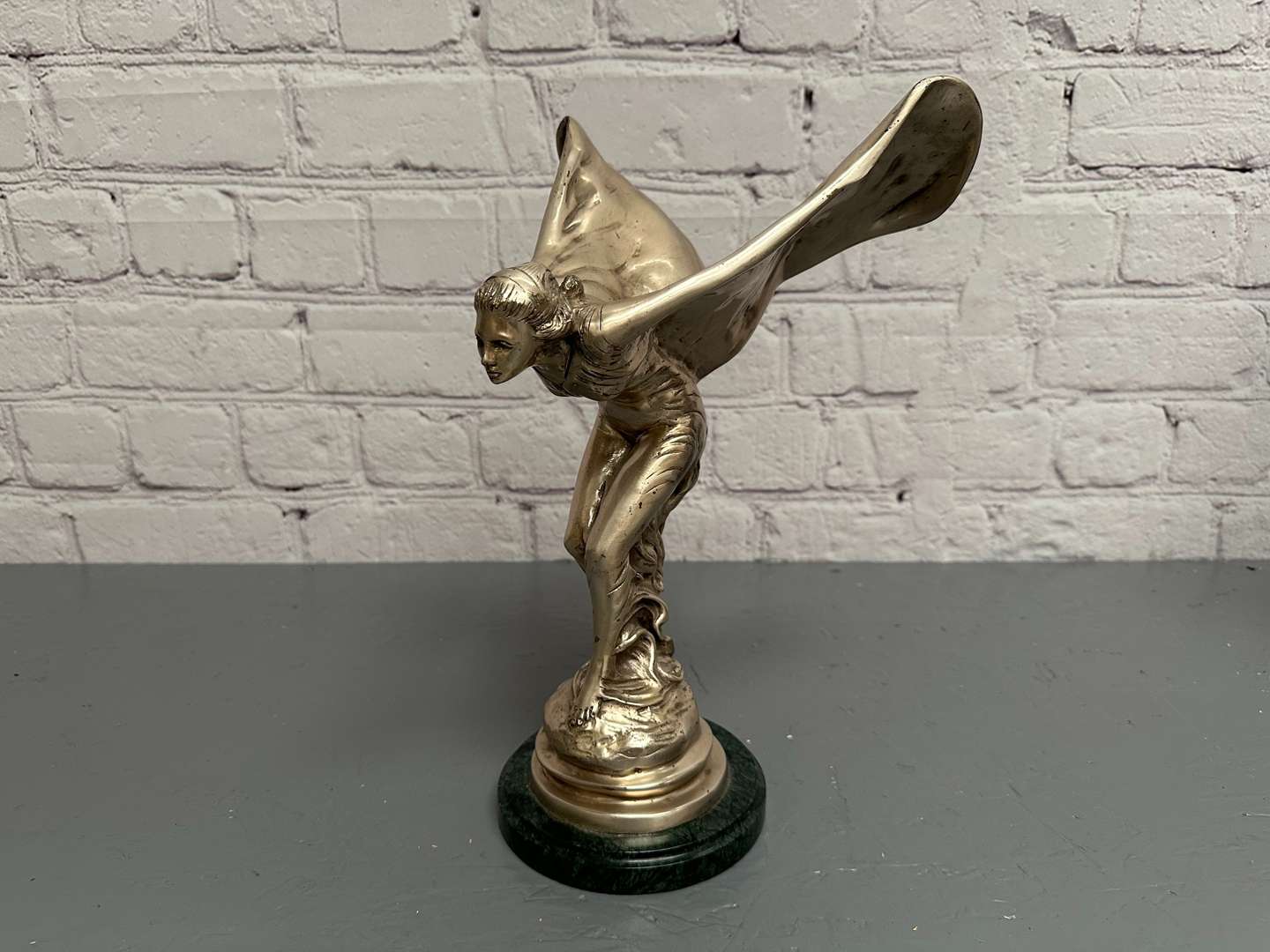 <p>&nbsp;“Spirit of Ecstasy” a late 20th century silvered cast metal desk mascot,</p>