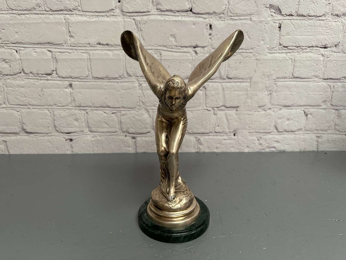 <p>&nbsp;“Spirit of Ecstasy” a late 20th century silvered cast metal desk mascot,</p>