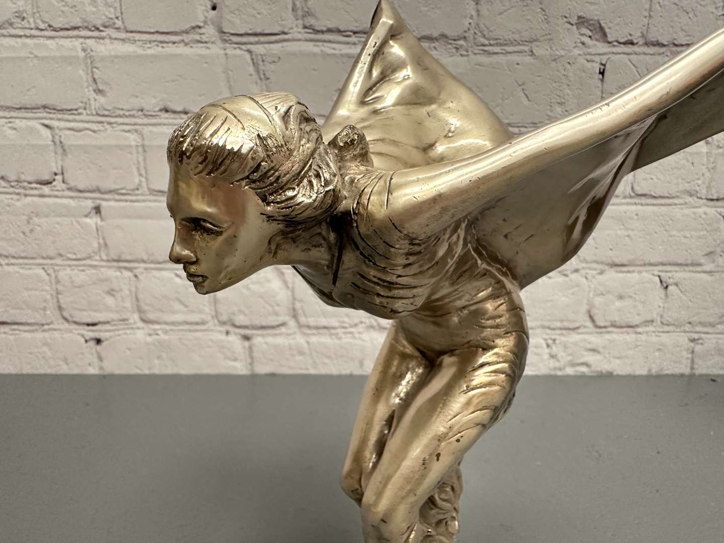 <p>&nbsp;“Spirit of Ecstasy” a late 20th century silvered cast metal desk mascot,</p>