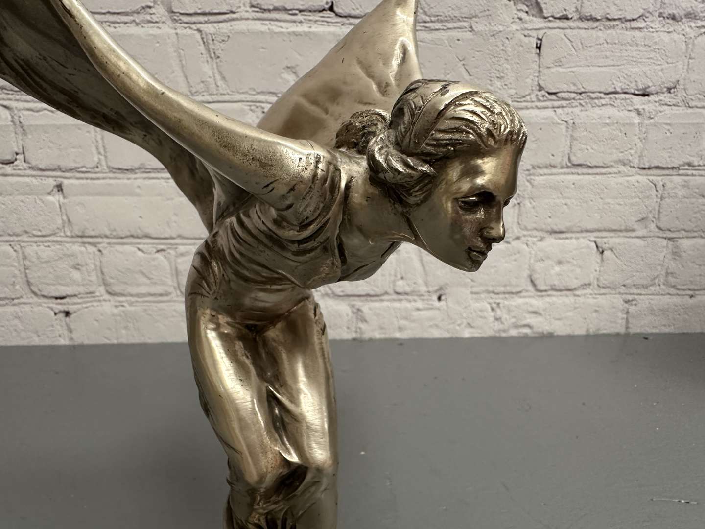 <p>&nbsp;“Spirit of Ecstasy” a late 20th century silvered cast metal desk mascot,</p>