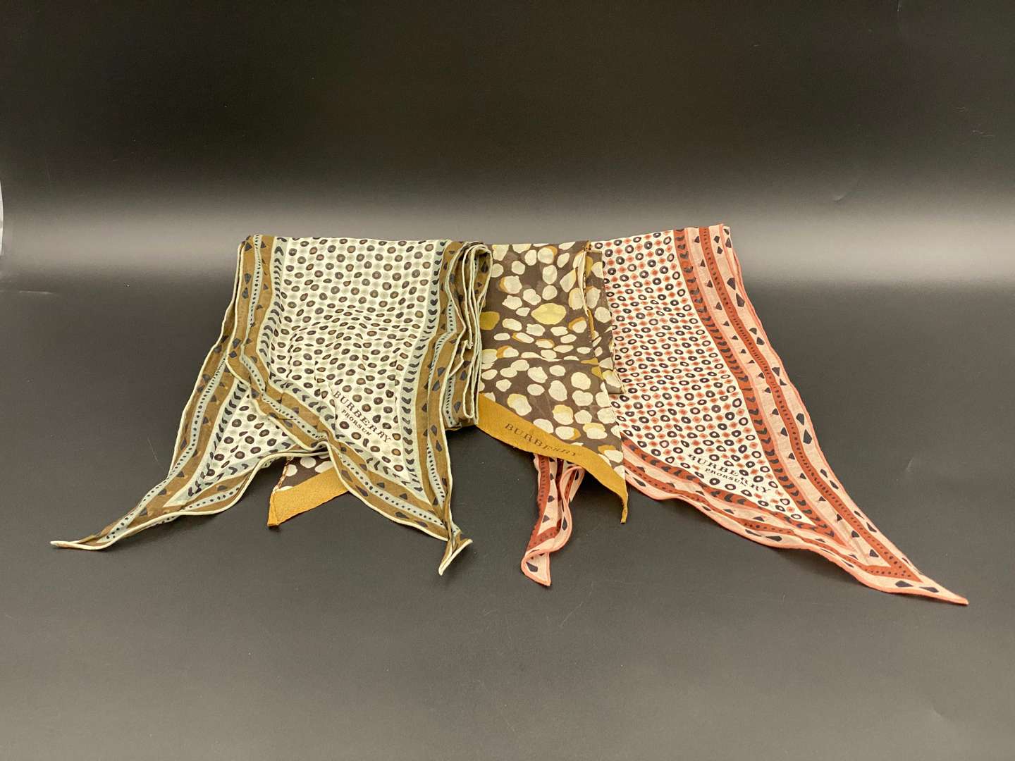 <p>BURBERRY, three various slim, neck scarves</p>