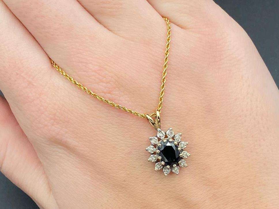 <p>9ct sapphire and gem set pendent & rope twist chain,&nbsp;</p>
