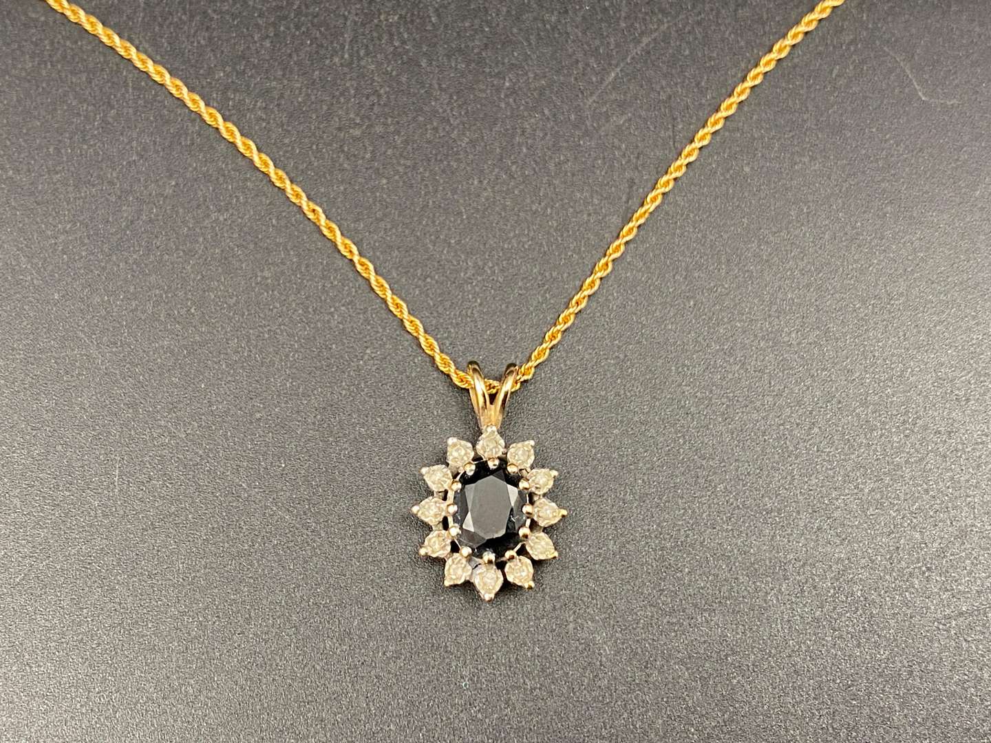 <p>9ct sapphire and gem set pendent & rope twist chain,&nbsp;</p>