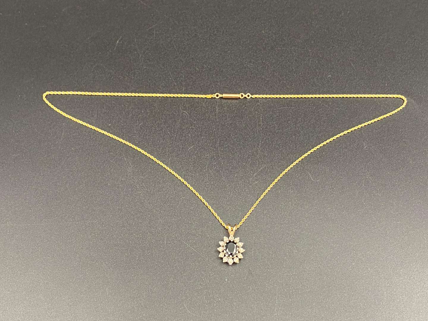 <p>9ct sapphire and gem set pendent & rope twist chain,&nbsp;</p>