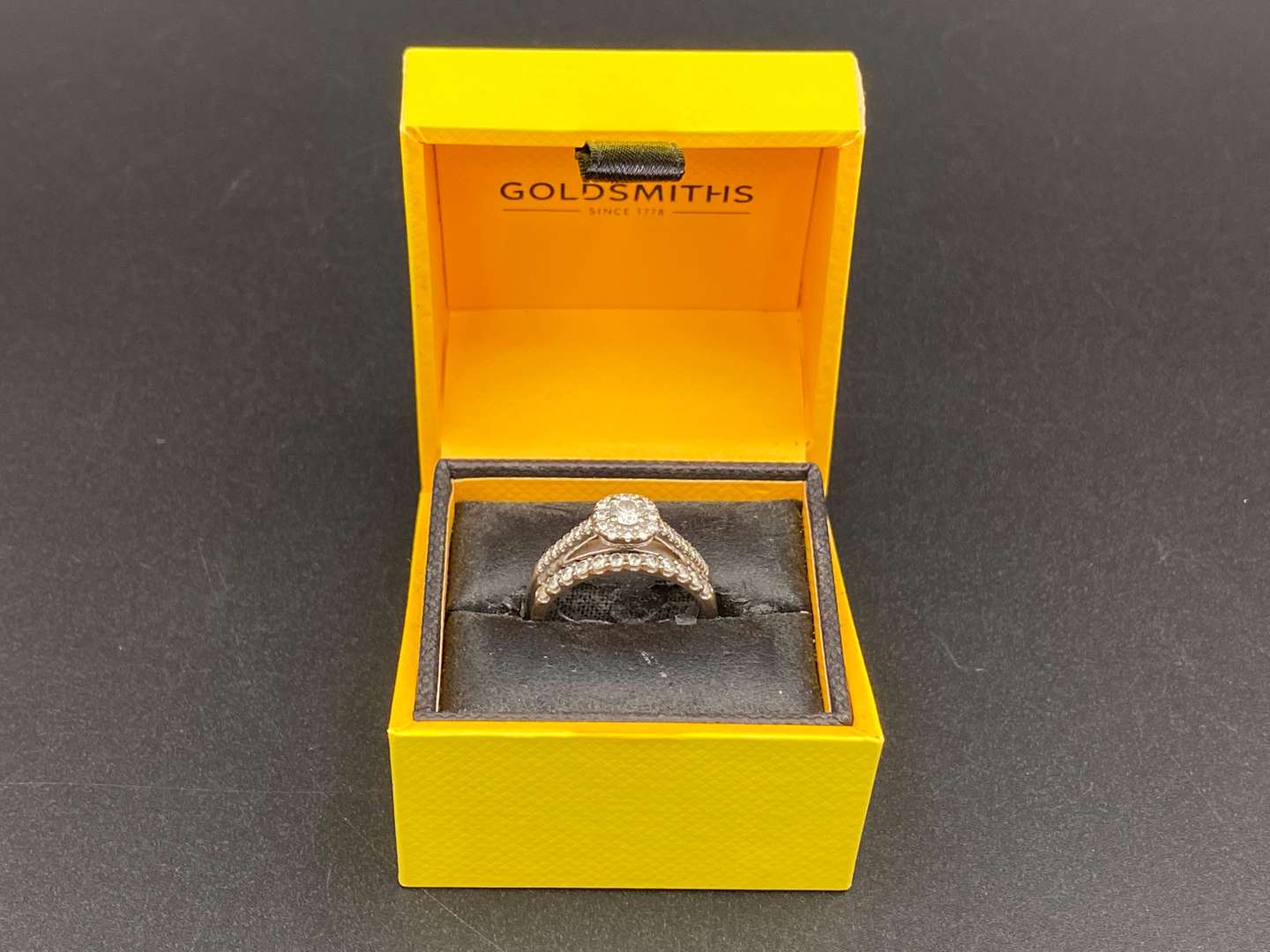 <p>GOLDSMITHS, a diamond set and 18ct white gold ring and another,</p>