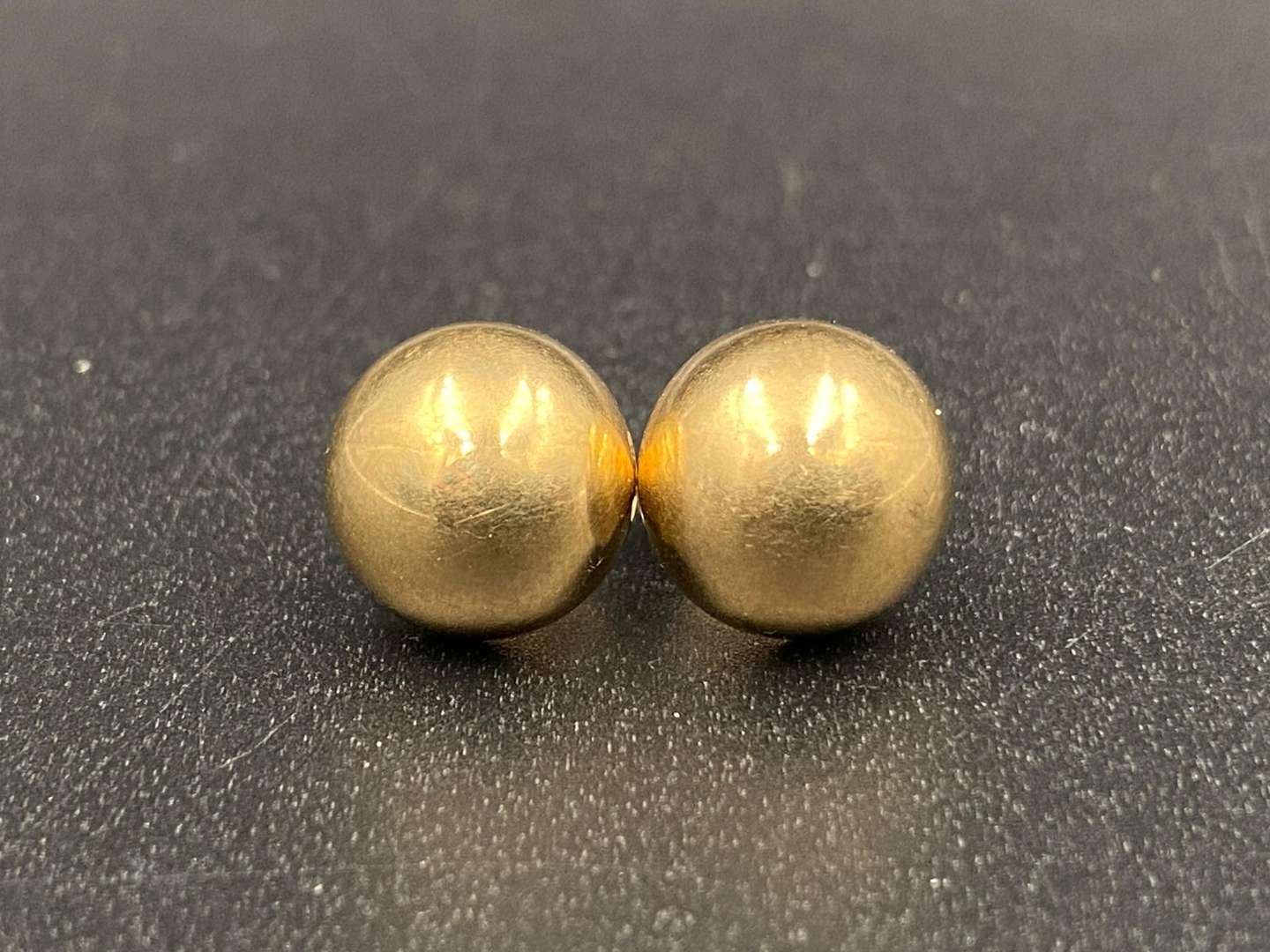<p>Pair of unmarked, ½ round ear studs</p>