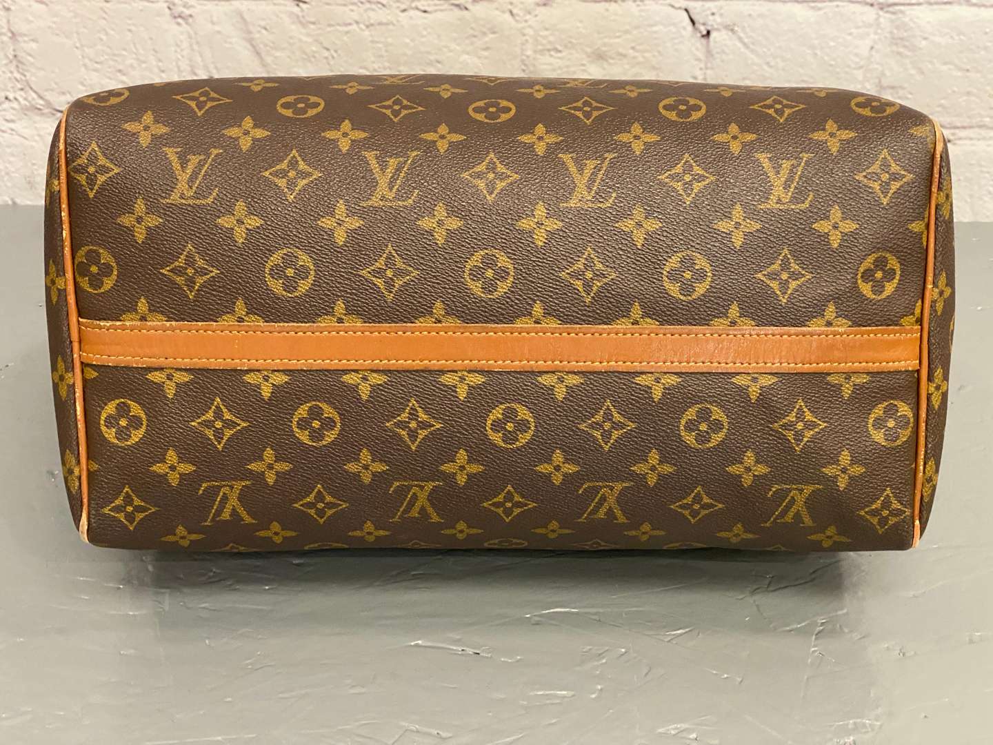 <p>LOUIS VUITTON, Speedy 35, monogram canvas and stitched leather holdall,</p>