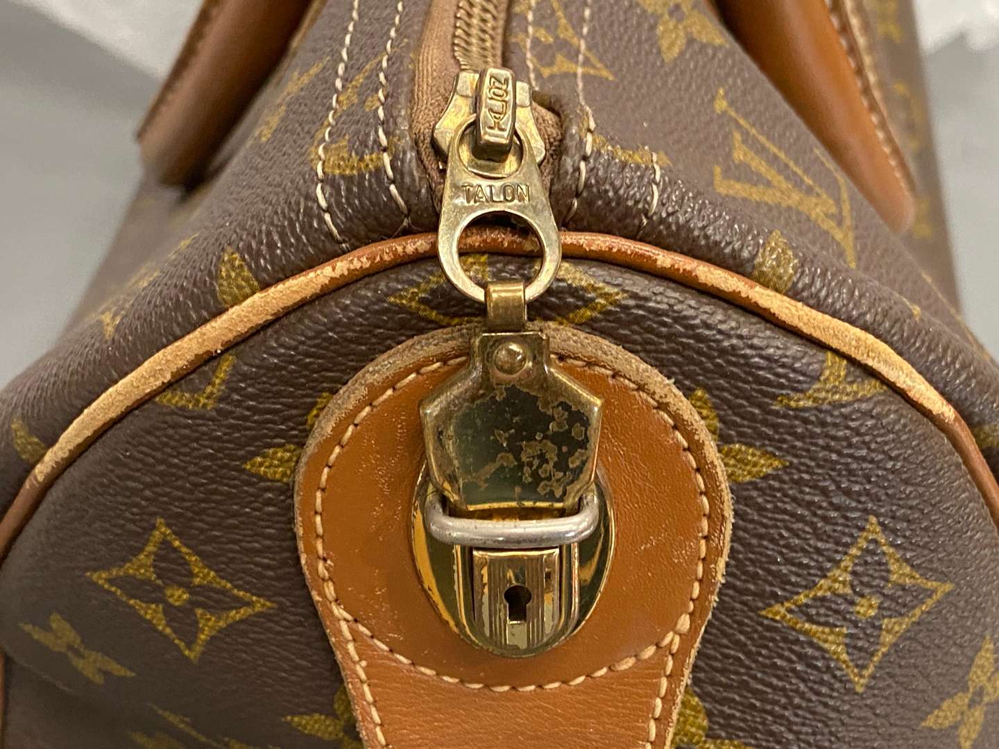 <p>LOUIS VUITTON, Speedy 35, monogram canvas and stitched leather holdall,</p>