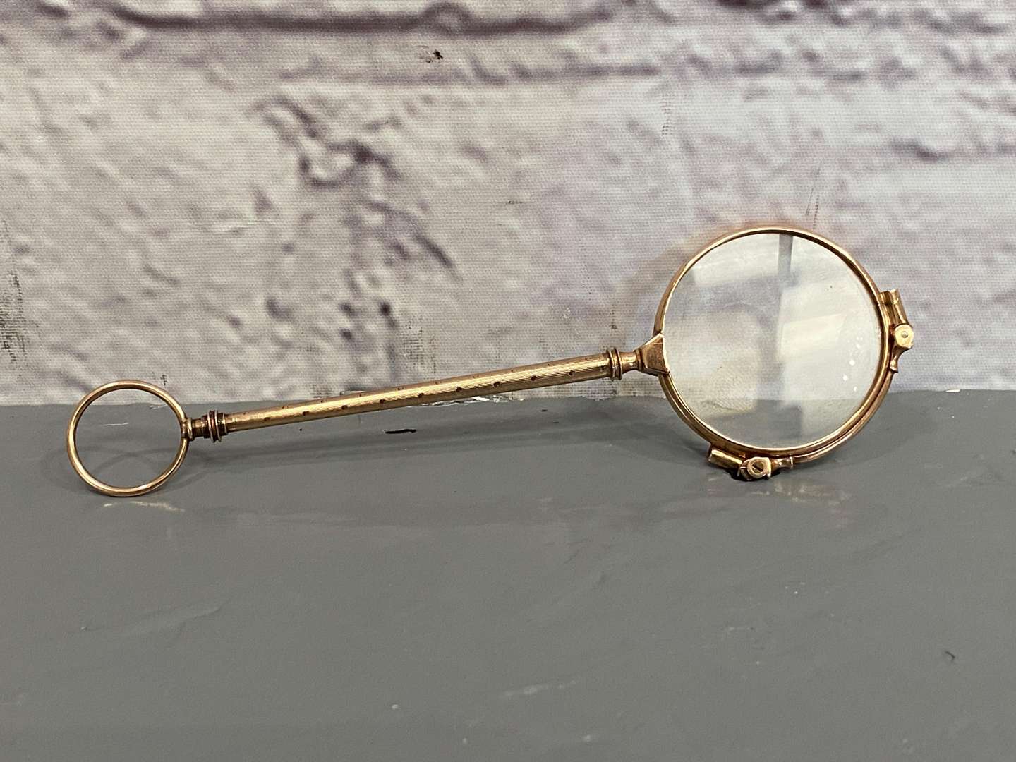 <p>A pair of late 19th century Continental, gold, &nbsp;folding Lorgnettes,</p>