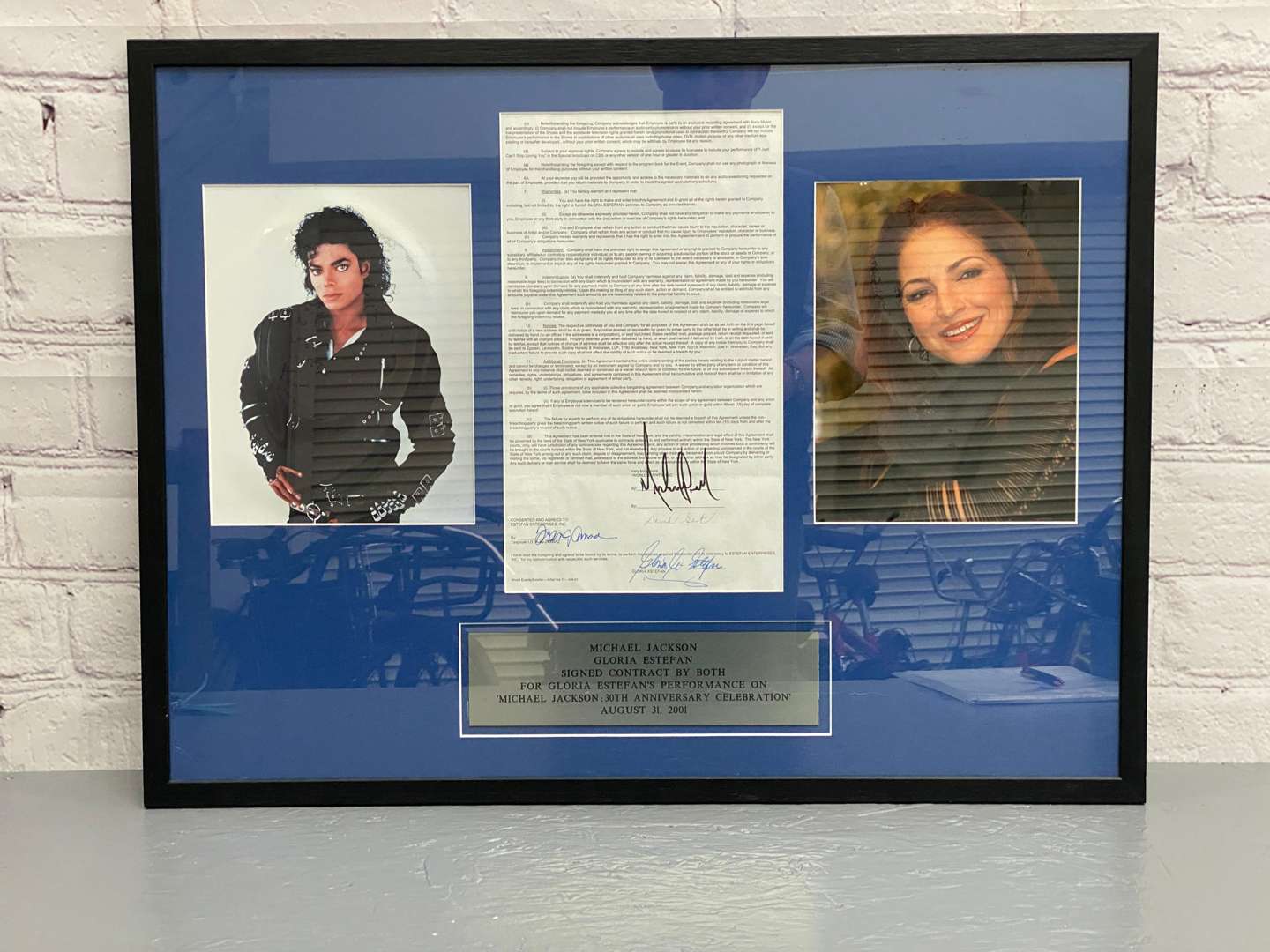 <p>Michael Jackson & Gloria Estefan, signed contract, framed with photographs “All Proceeds to Charity”</p>