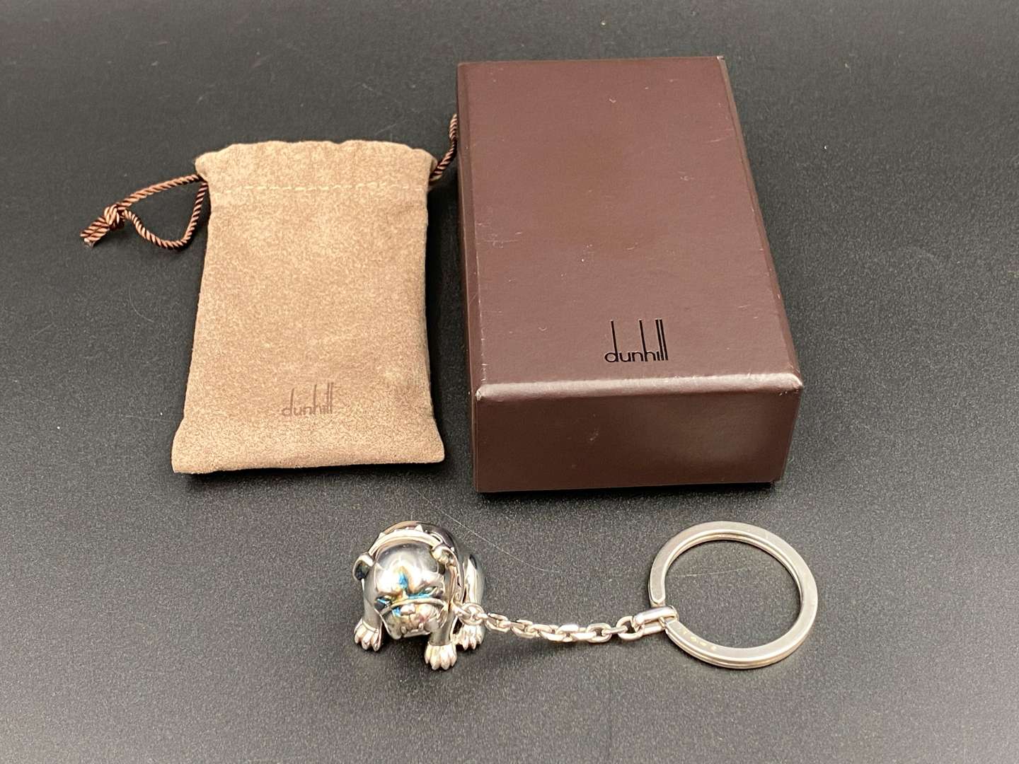<p>DUNHILL, a Continental silver “Bulldog” key chain and fob,</p>