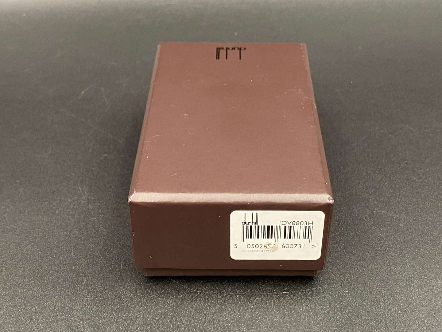 <p>DUNHILL, a Continental silver “Bulldog” key chain and fob,</p>