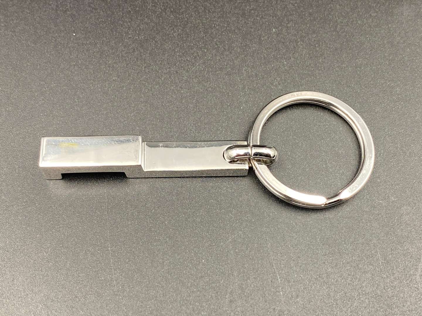 <p>DUNHILL, a modern silver and chrome metal keyring,</p>