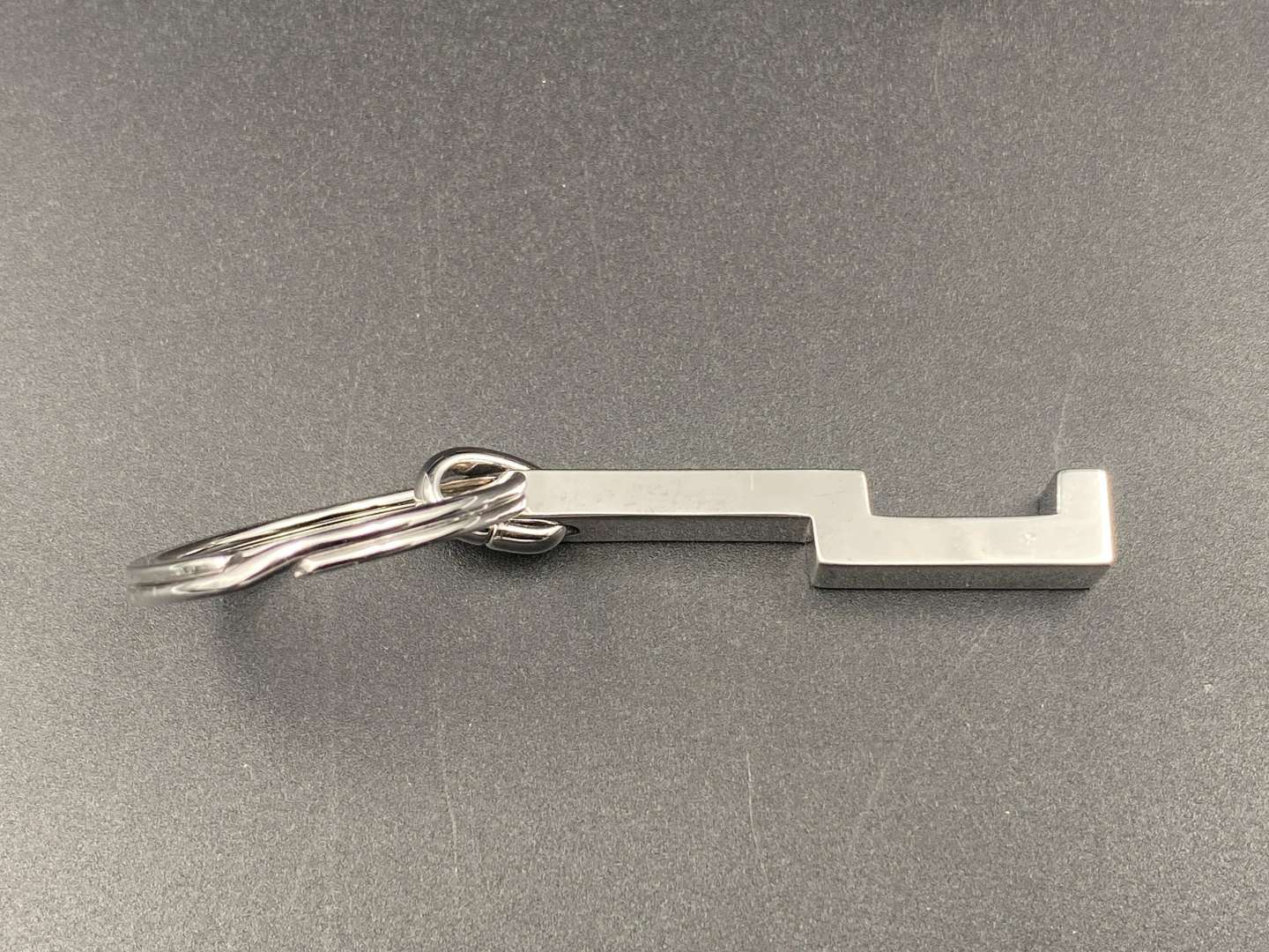 <p>DUNHILL, a modern silver and chrome metal keyring,</p>