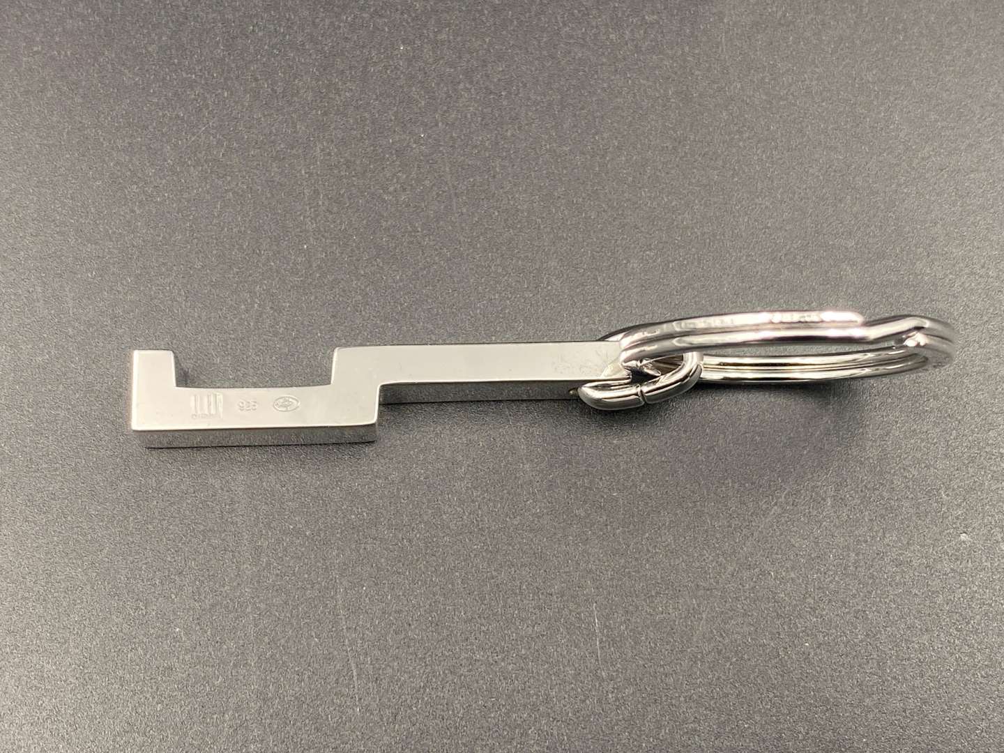 <p>DUNHILL, a modern silver and chrome metal keyring,</p>