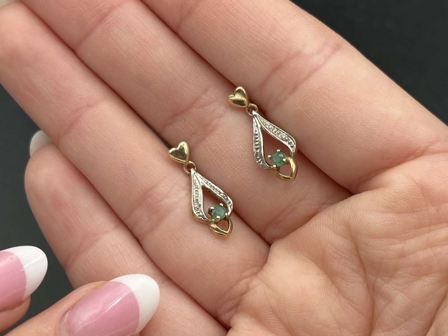 <p>Pair of yellow metal and emerald earrings</p>