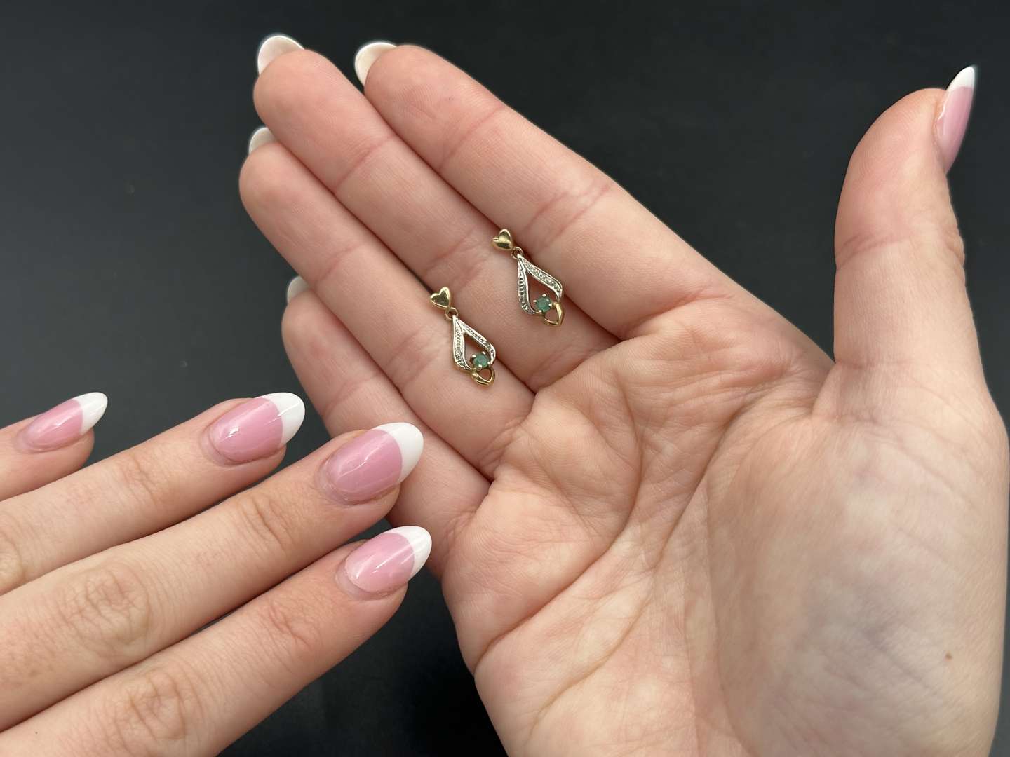 <p>Pair of yellow metal and emerald earrings</p>