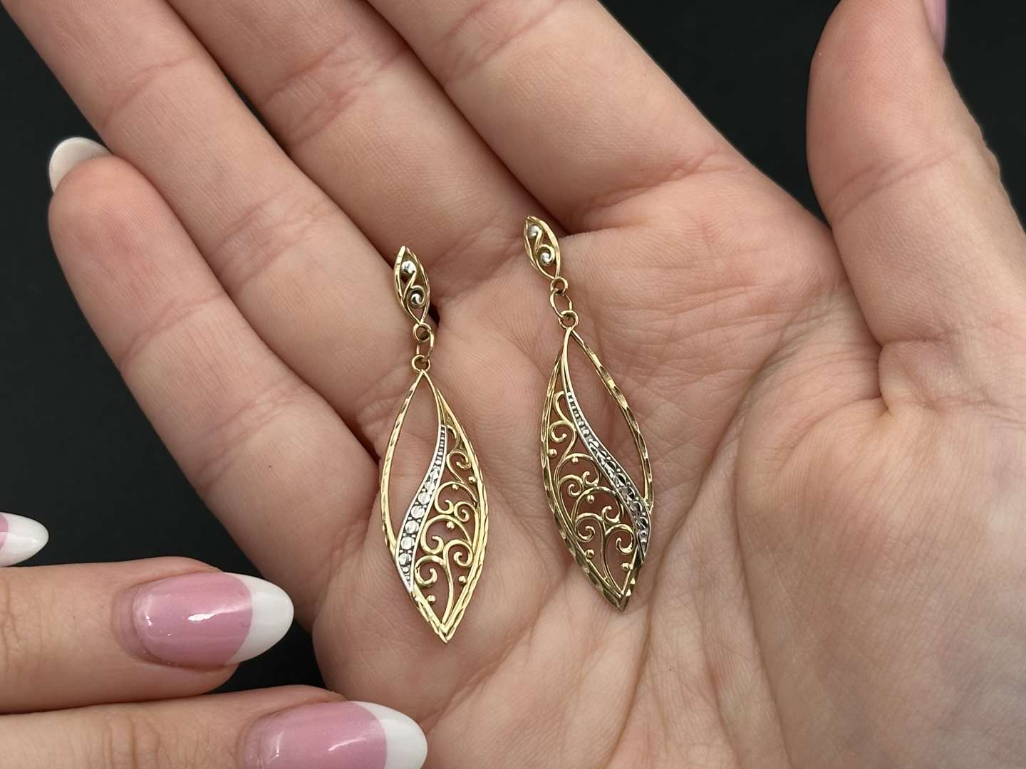 <p>Gold Swirl Drop Earrings</p>