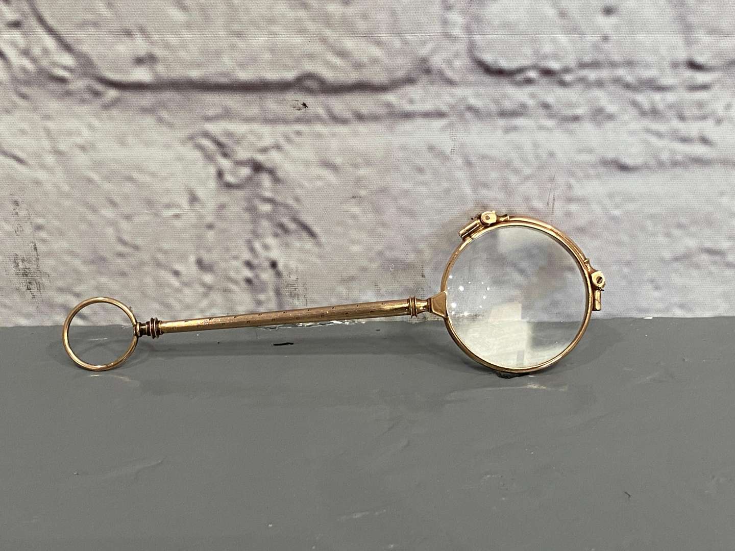 <p>A pair of late 19th century Continental, gold, &nbsp;folding Lorgnettes,</p>