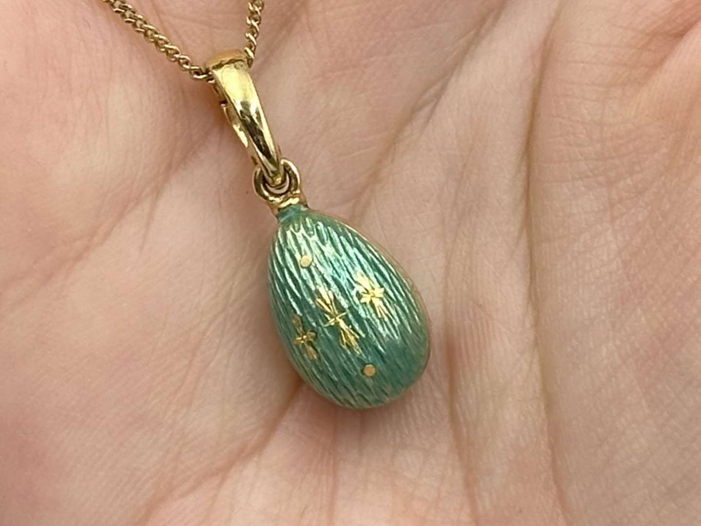 <p>FABERGE, a .750 and enamel Egg pendant, 241/500</p>