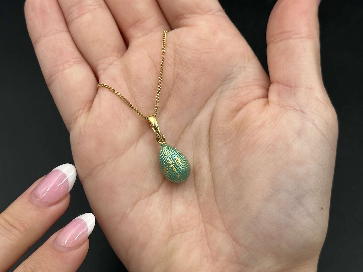 <p>FABERGE, a .750 and enamel Egg pendant, 241/500</p>