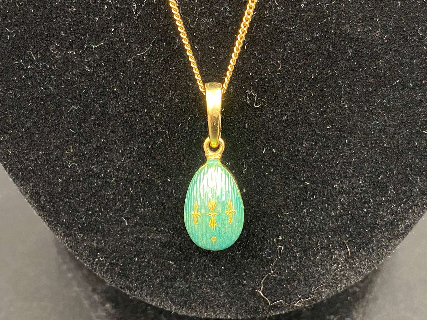 <p>FABERGE, a .750 and enamel Egg pendant, 241/500</p>