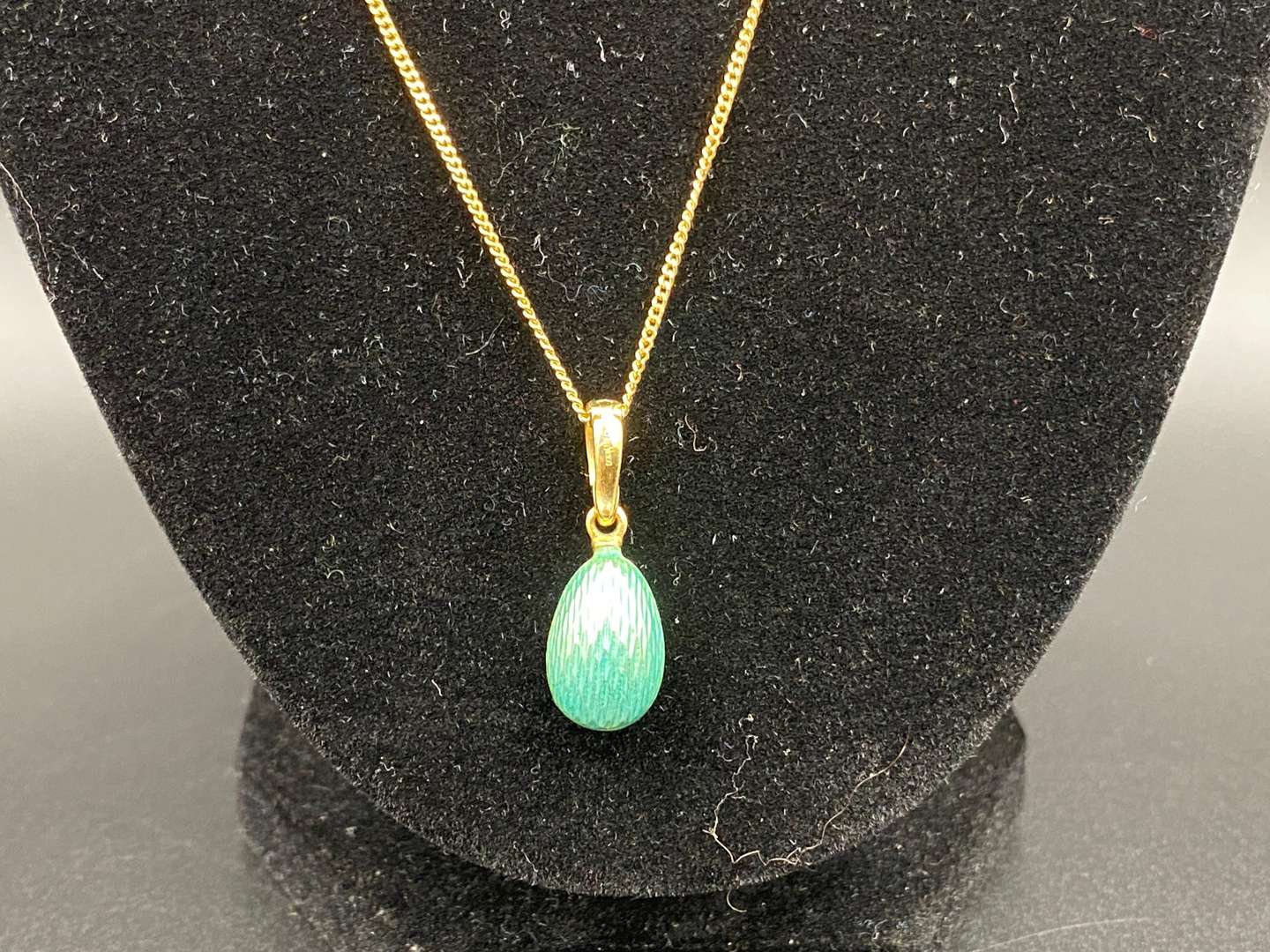 <p>FABERGE, a .750 and enamel Egg pendant, 241/500</p>