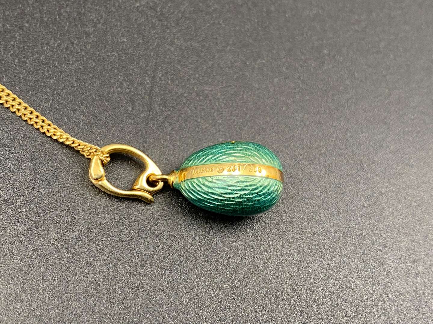 <p>FABERGE, a .750 and enamel Egg pendant, 241/500</p>