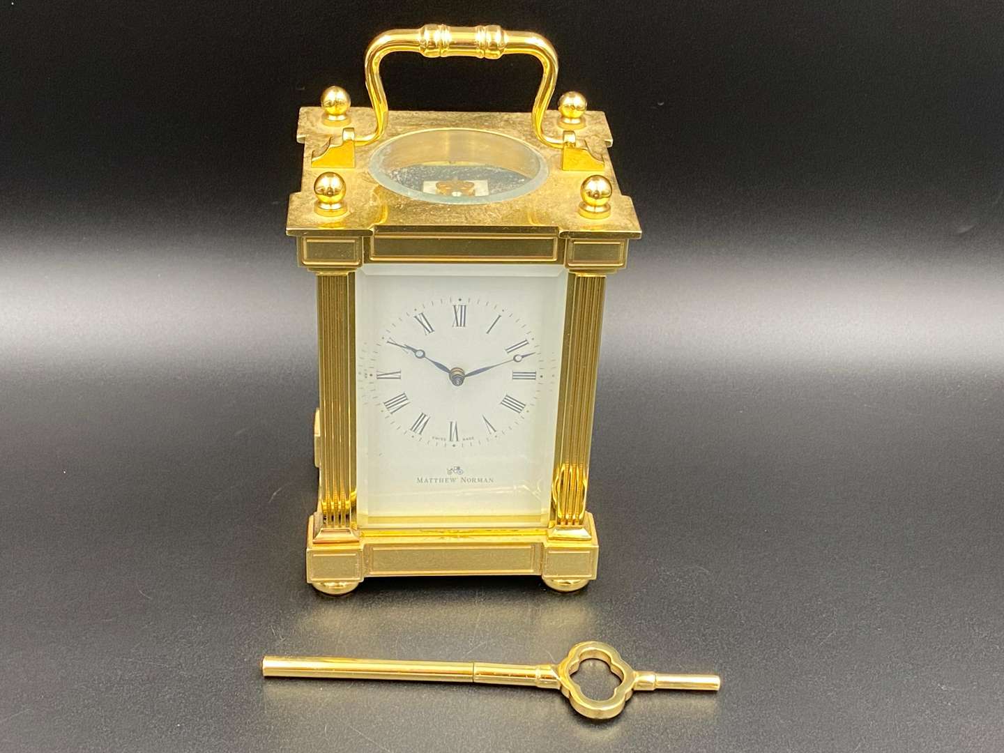<p>MATTHEW NORMAN, a modern, Swiss, lacquered brass carriage clock, 1751A/50A, 14514</p>