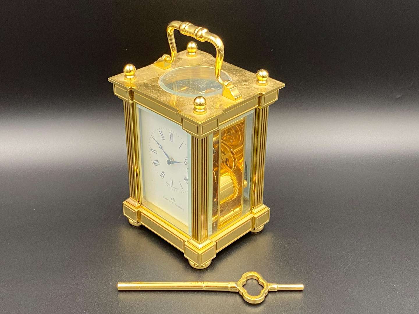 <p>MATTHEW NORMAN, a modern, Swiss, lacquered brass carriage clock, 1751A/50A, 14514</p>
