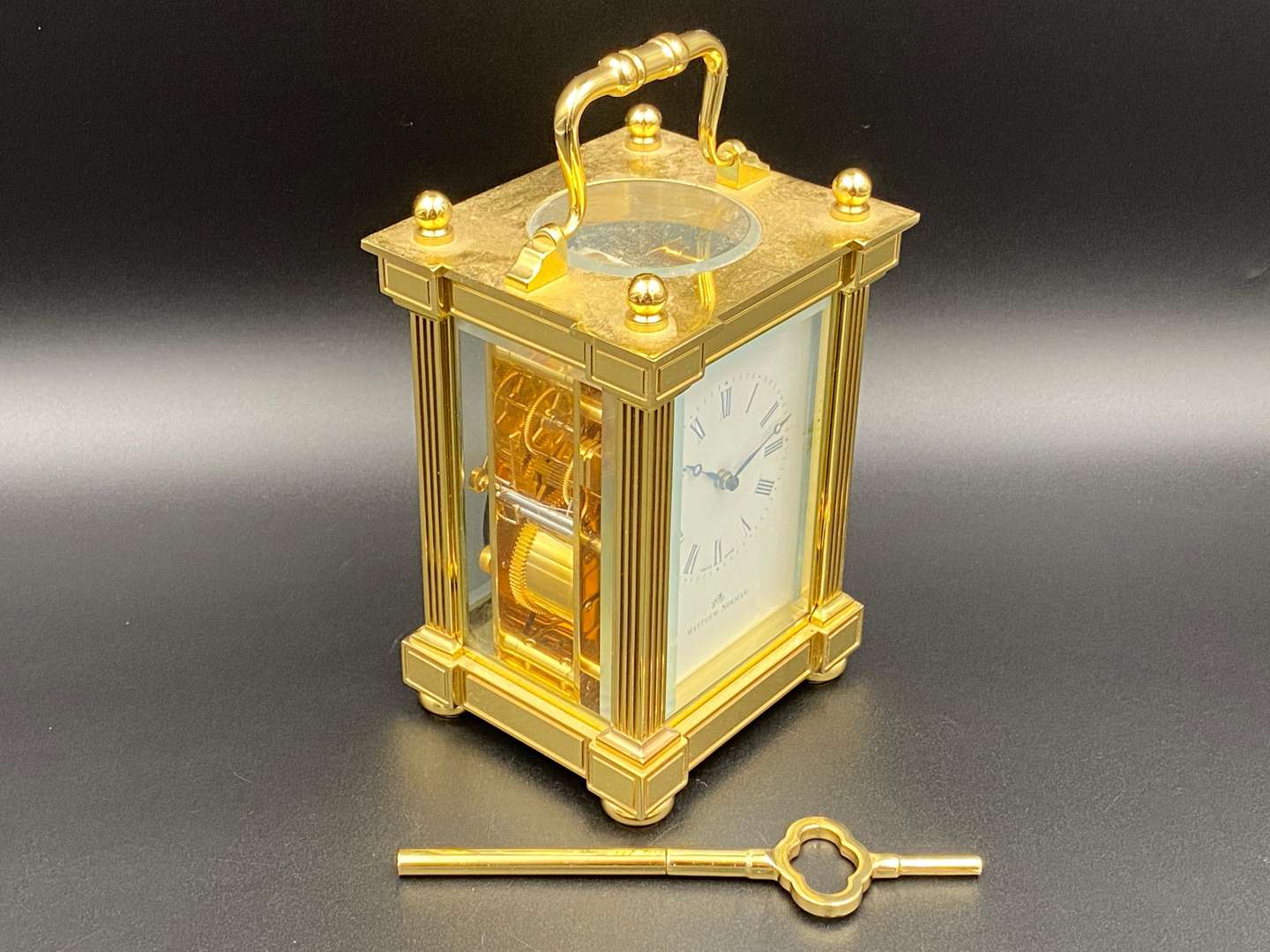 <p>MATTHEW NORMAN, a modern, Swiss, lacquered brass carriage clock, 1751A/50A, 14514</p>