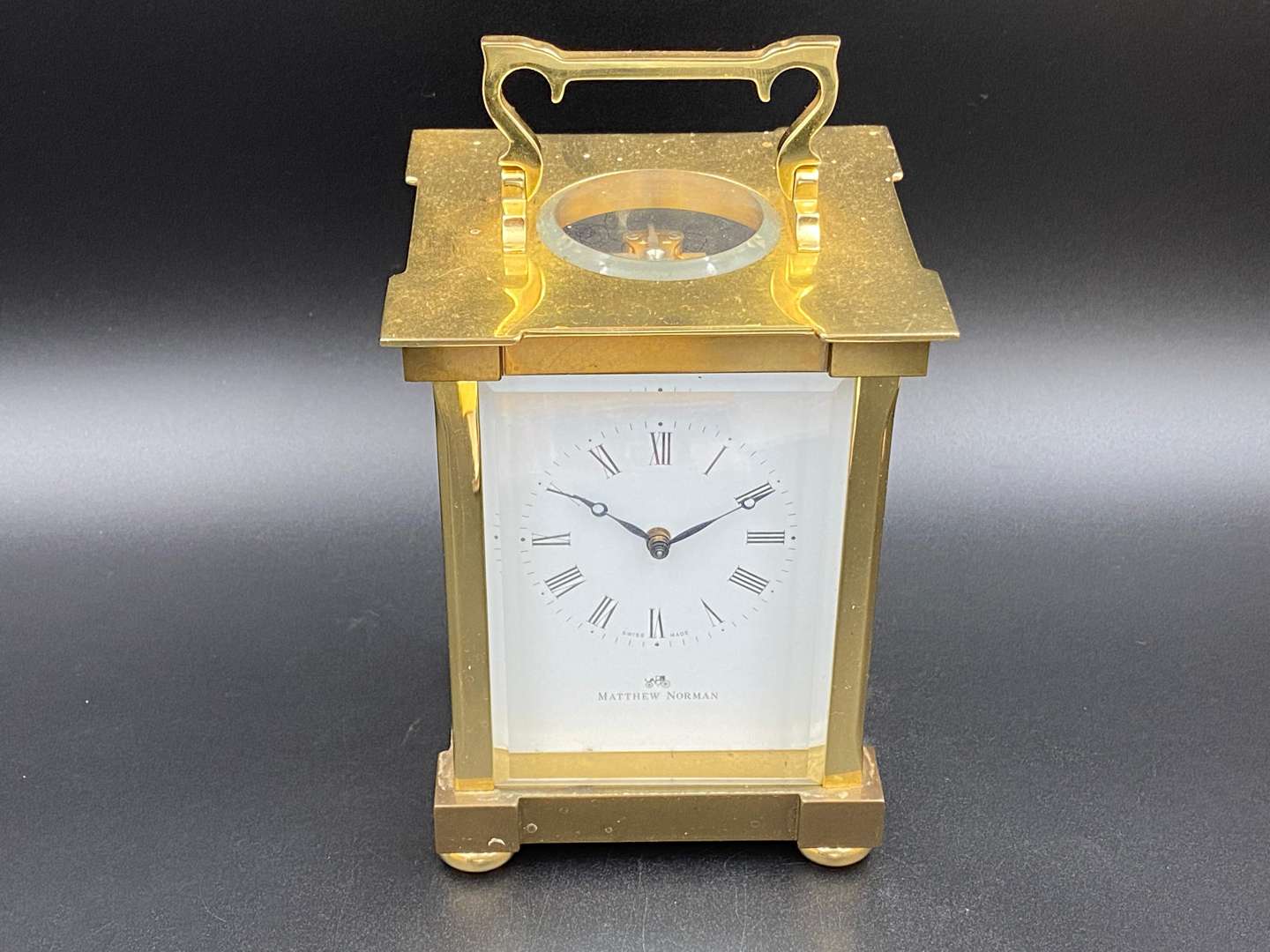 <p>MATTHEW NORMAN, a modern, Swiss, lacquered brass carriage clock, 1751A/50A, 13114</p>