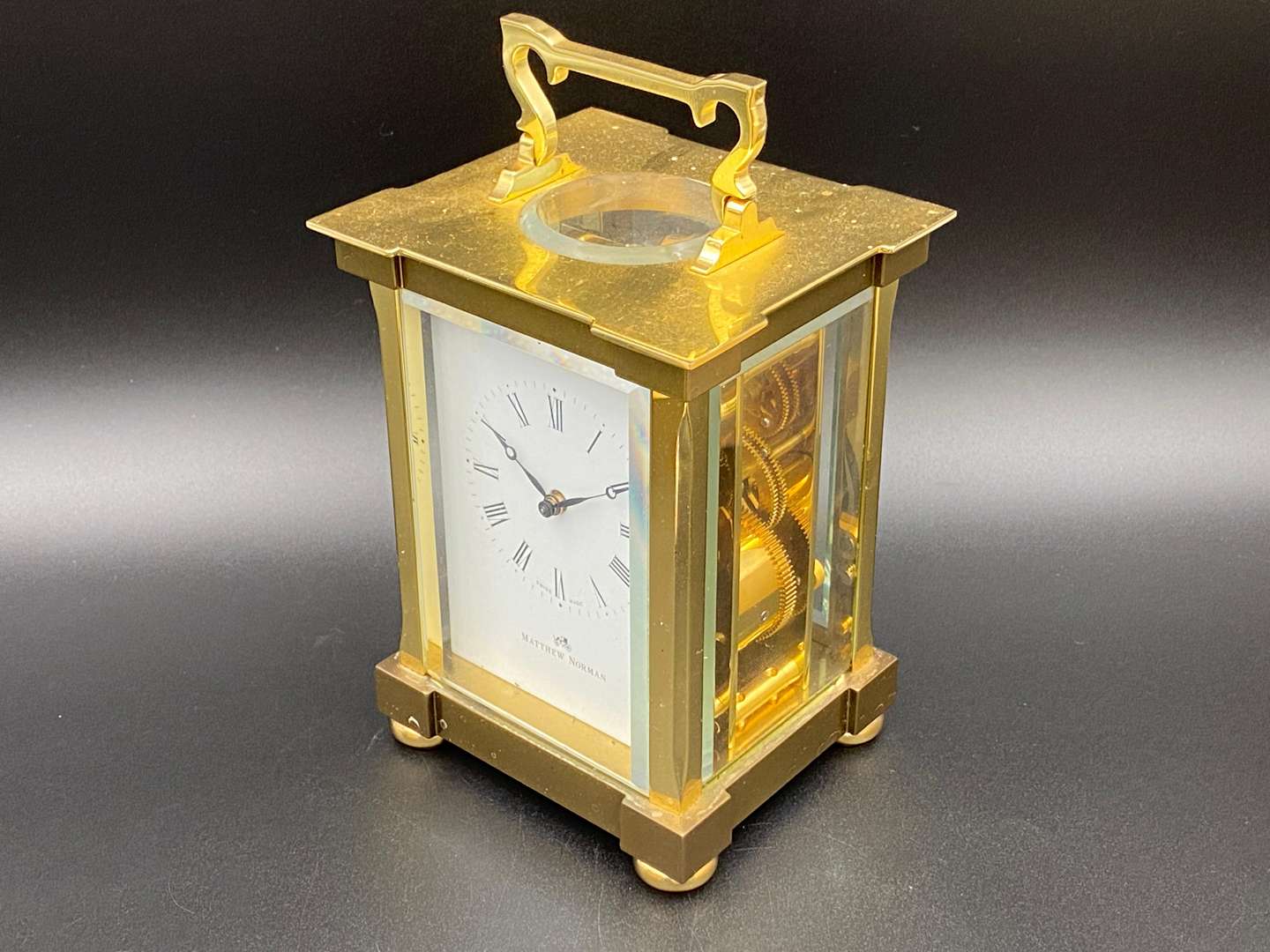 <p>MATTHEW NORMAN, a modern, Swiss, lacquered brass carriage clock, 1751A/50A, 13114</p>