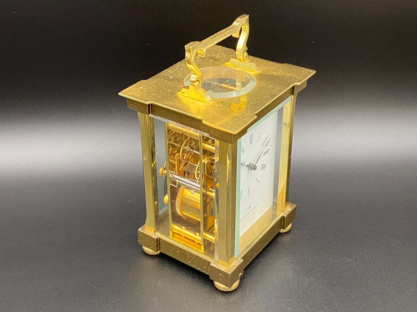 <p>MATTHEW NORMAN, a modern, Swiss, lacquered brass carriage clock, 1751A/50A, 13114</p>