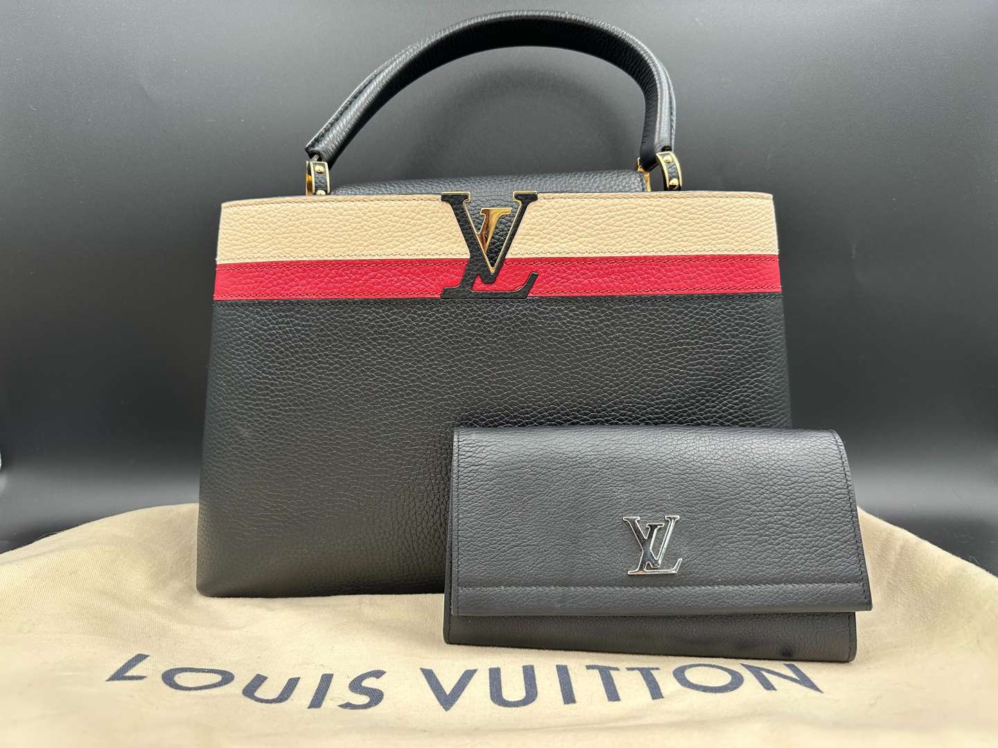 <p>LOUIS VUITTON, Capucine, tri-colour leather handbag and purse,</p>