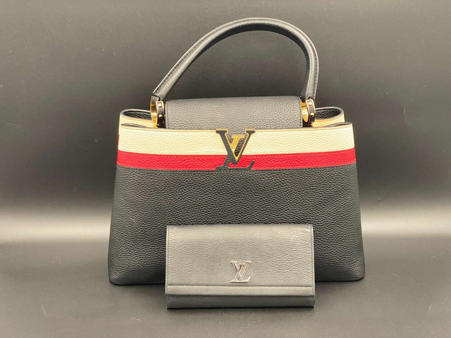 <p>LOUIS VUITTON, Capucine, tri-colour leather handbag and purse,</p>