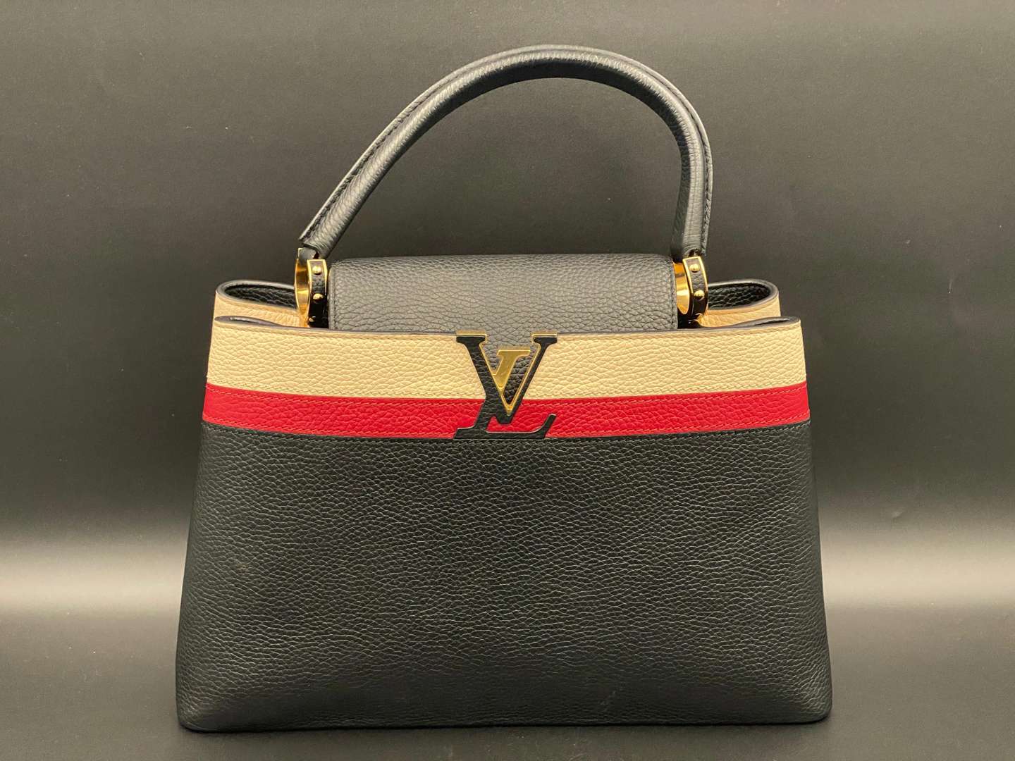 <p>LOUIS VUITTON, Capucine, tri-colour leather handbag and purse,</p>