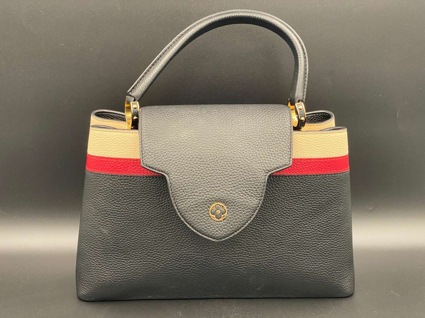 <p>LOUIS VUITTON, Capucine, tri-colour leather handbag and purse,</p>